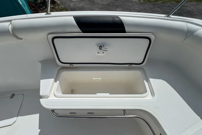 Slide: The Image of Open storage compartment on a 2000 Century 3200 Center Console boat. - 85