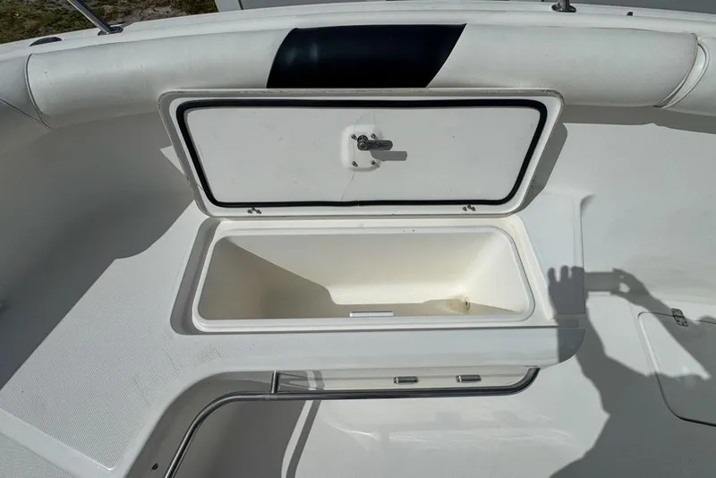 Slide: The Image of Open storage compartment on a 2000 Century 3200 Center Console boat. - 86