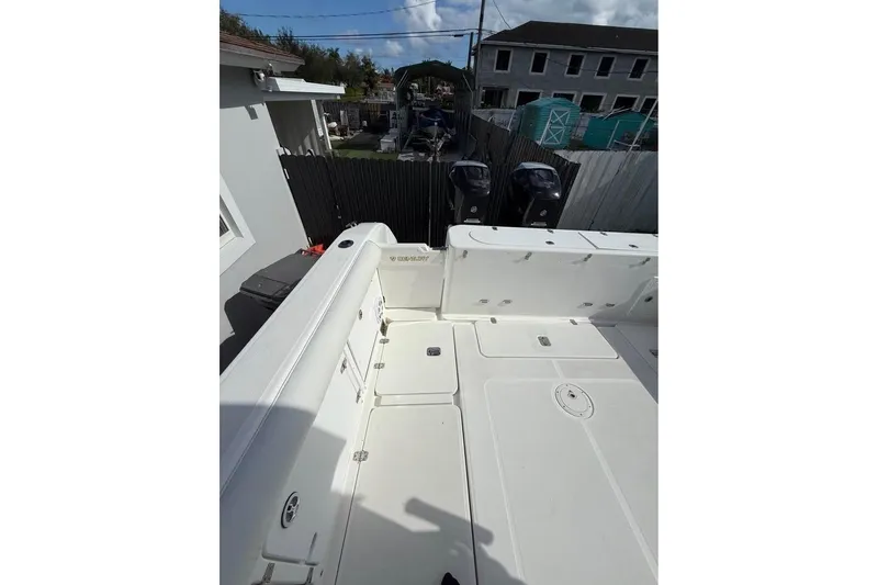 Slide: The Image of Century 3200 Center Console boat, 2000 model, on trailer beside house. - 9