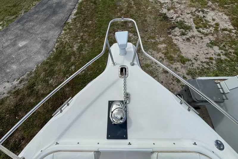 Slide: The Image of Bow view of 2000 Century 3200 Center Console boat with anchor and railing. - 91