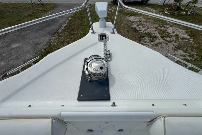 Slide: The Image of Bow of 2000 Century 3200 Center Console with anchor windlass and railing. - 94