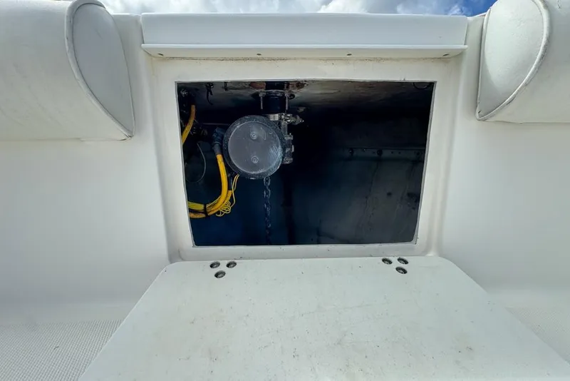 Slide: The Image of Open storage compartment on a 2000 Century 3200 Center Console boat. - 95