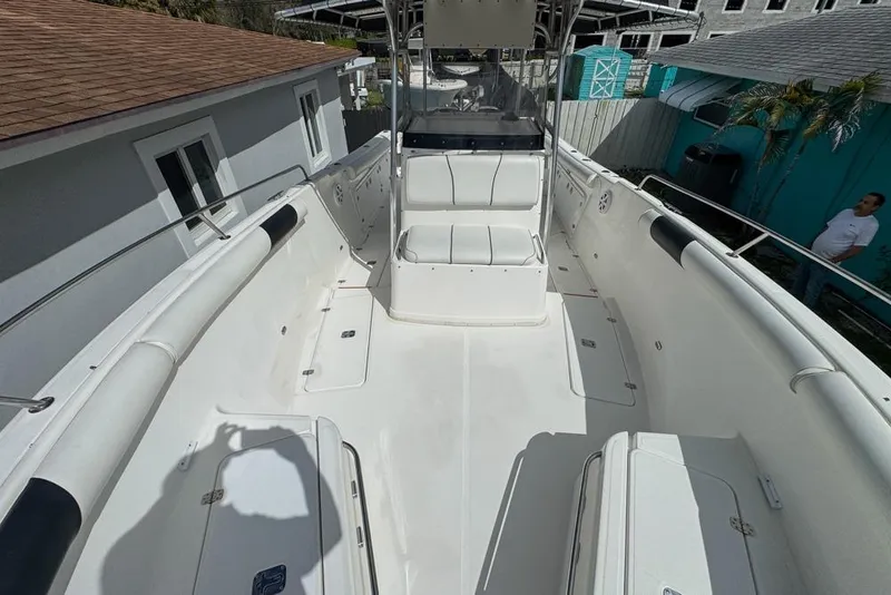 Slide: The Image of 2000 Century 3200 Center Console boat with spacious deck and seating area. - 98