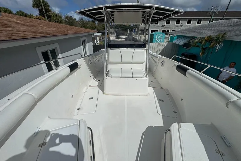 Slide: The Image of 2000 Century 3200 Center Console boat with spacious deck and seating area. - 99