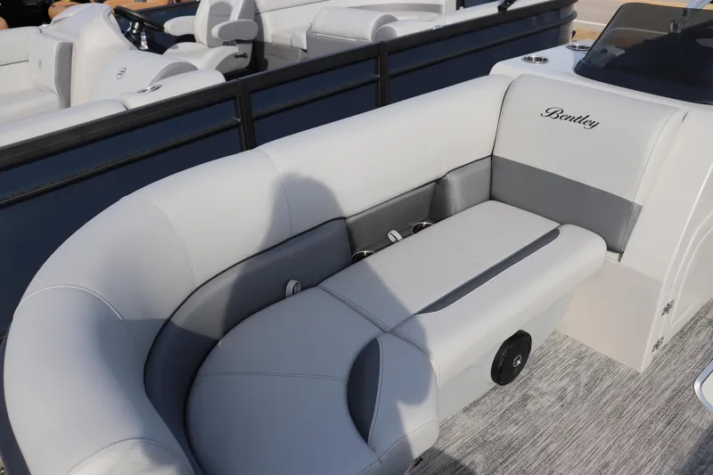 Slide: The Image of 2026 Bentley Pontoons Legacy 223 Swingback with luxurious seating and elegant design. - 2