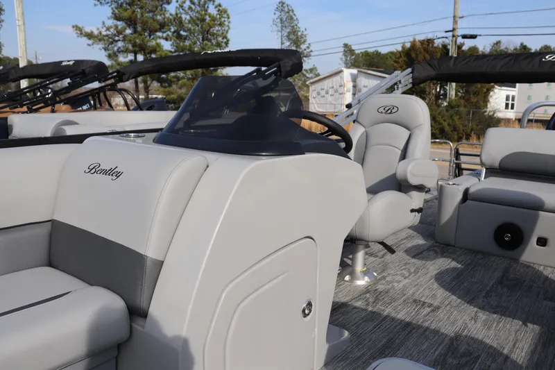 Slide: The Image of 2026 Bentley Pontoons Legacy 223 Swingback interior with sleek seating and modern helm design. - 4