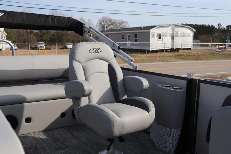 Slide: The Image of 2026 Bentley Pontoons Legacy 223 Swingback interior with luxurious seating and cup holders. - 6