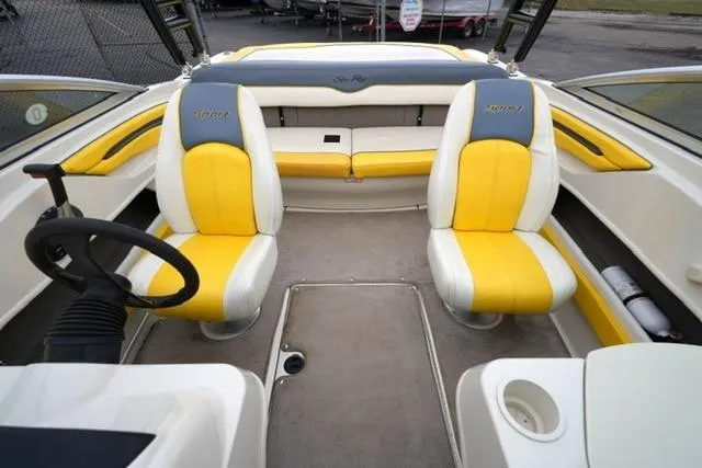 Slide: The Image of 2006 Sea Ray 205 Sport boat interior with yellow and white seating. - 11
