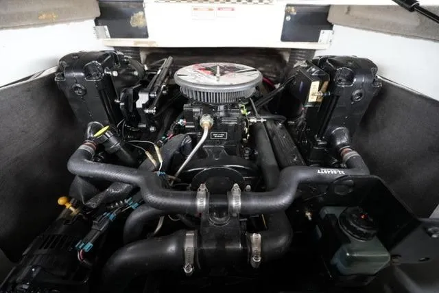 Slide: The Image of Engine compartment of a 2006 Sea Ray 205 Sport boat, showcasing detailed components. - 16