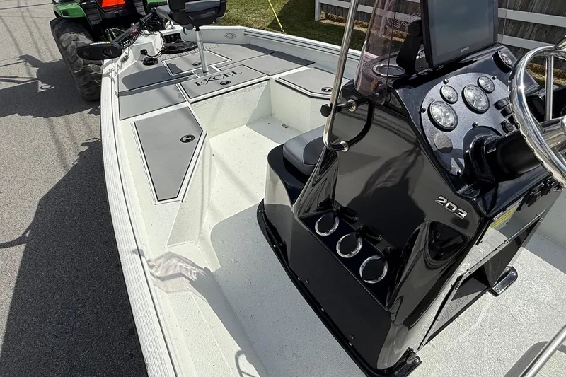 Slide: The Image of 2020 Excel 203 Bay Pro boat interior with steering console and seating. - 12