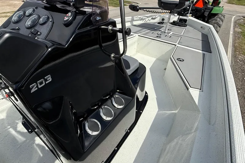 Slide: The Image of 2020 Excel 203 Bay Pro boat interior with console and seating, showcasing modern design. - 14