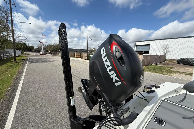 Slide: The Image of 2020 Excel 203 Bay Pro boat with Suzuki outboard motor on a sunny day. - 18