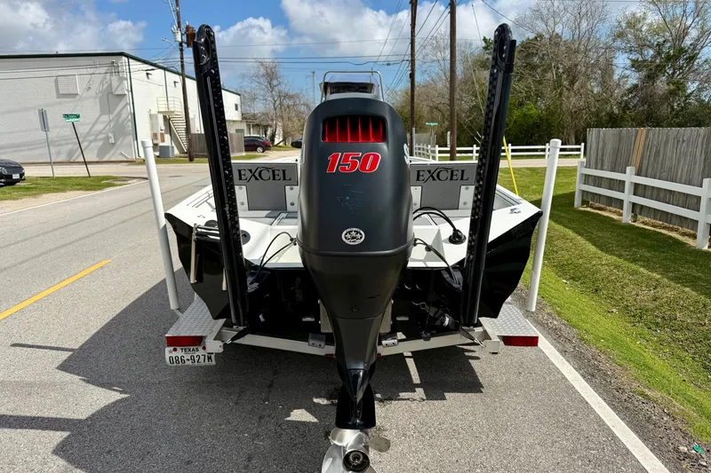 Slide: The Image of 2020 Excel 203 Bay Pro boat with 150 horsepower engine on trailer. - 3