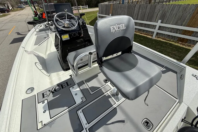 Slide: The Image of 2020 Excel 203 Bay Pro boat interior with steering console and seating. - 9
