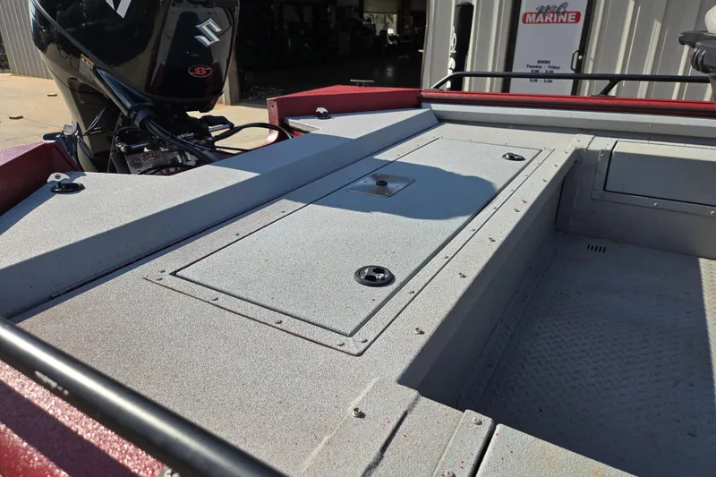 Slide: The Image of 2023 SeaArk ProCat 240 boat deck with Suzuki outboard motor in a marine setting. - 17