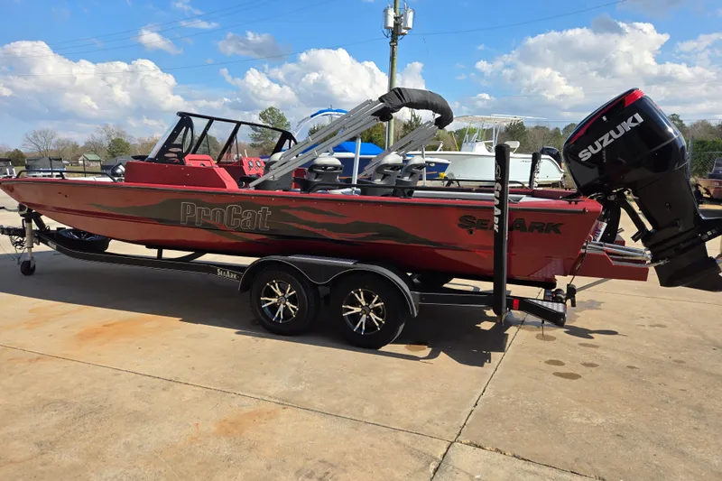 Slide: The Image of 2023 SeaArk ProCat 240 boat with Suzuki outboard motor on a trailer. - 3