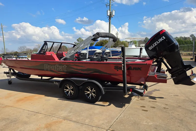 Slide: The Image of 2023 SeaArk ProCat 240 boat with Suzuki outboard motor on trailer. - 4