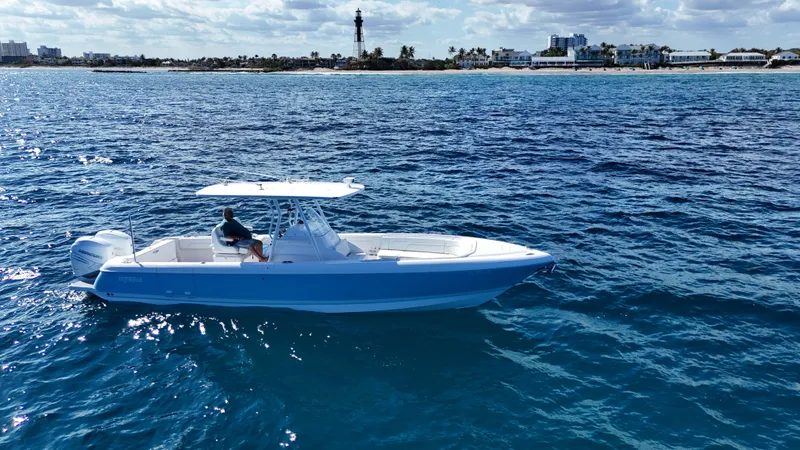 The Image of 2019 Intrepid 327 boat cruising on open sea. - 0