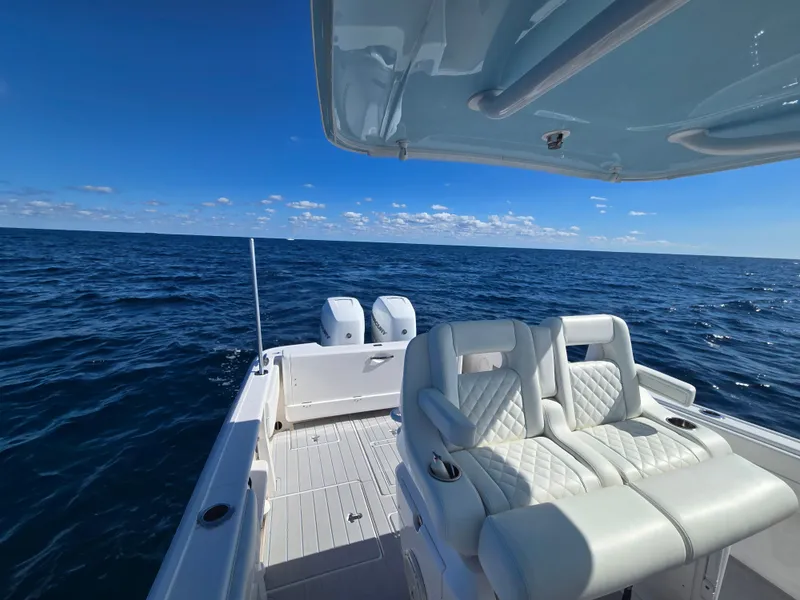 Slide: The Image of 2019 Intrepid 327 boat on open sea under clear sky. - 10