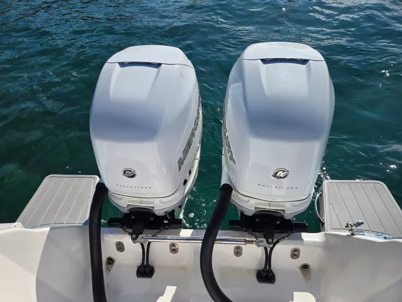 Slide: The Image of Two Mercury outboard engines on an Intrepid 327 boat, 2019 model. - 13