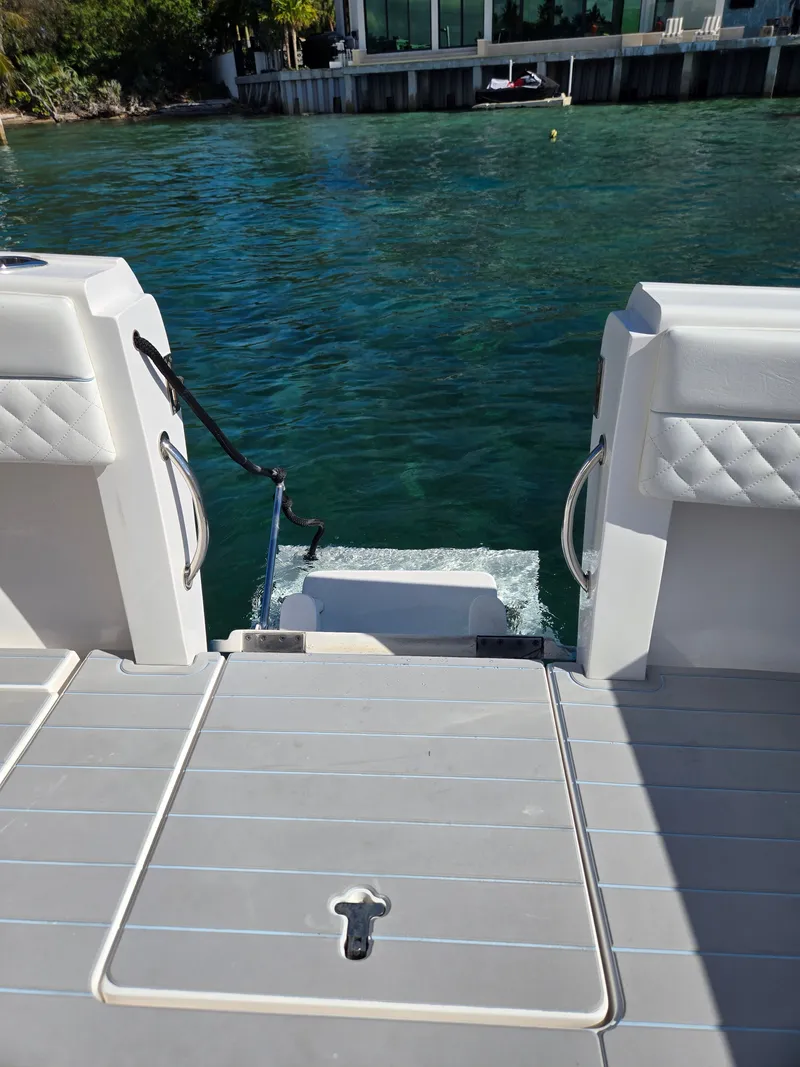 Slide: The Image of Intrepid 327 boat deck overlooking water, 2019 model. - 14