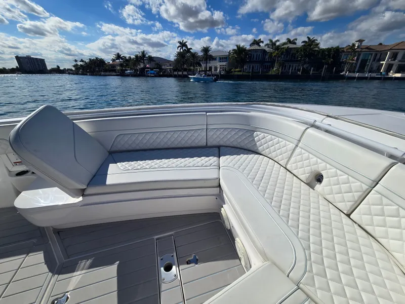 Slide: The Image of Luxurious seating area on a 2019 Intrepid 327 boat. - 16