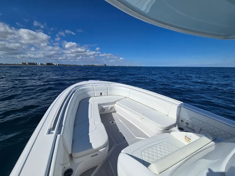 Slide: The Image of Intrepid 327 boat from 2019 on open sea under clear sky. - 17