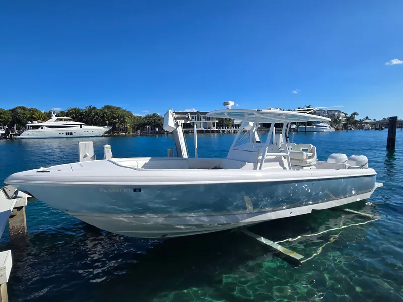 Slide: The Image of 2019 Intrepid 327 boat docked in sunny harbor. - 18