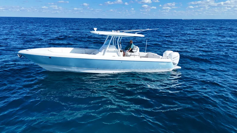 Slide: The Image of 2019 Intrepid 327 boat on open sea under sunny skies. - 20