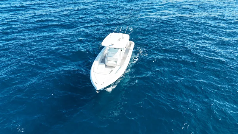 Slide: The Image of 2019 Intrepid 327 boat on open sea. - 23