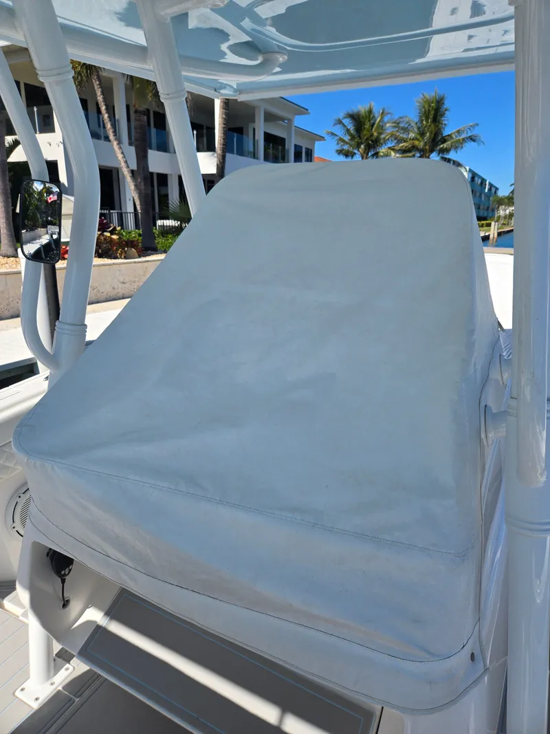 Slide: The Image of Covered helm station of a 2019 Intrepid 327 boat. - 26