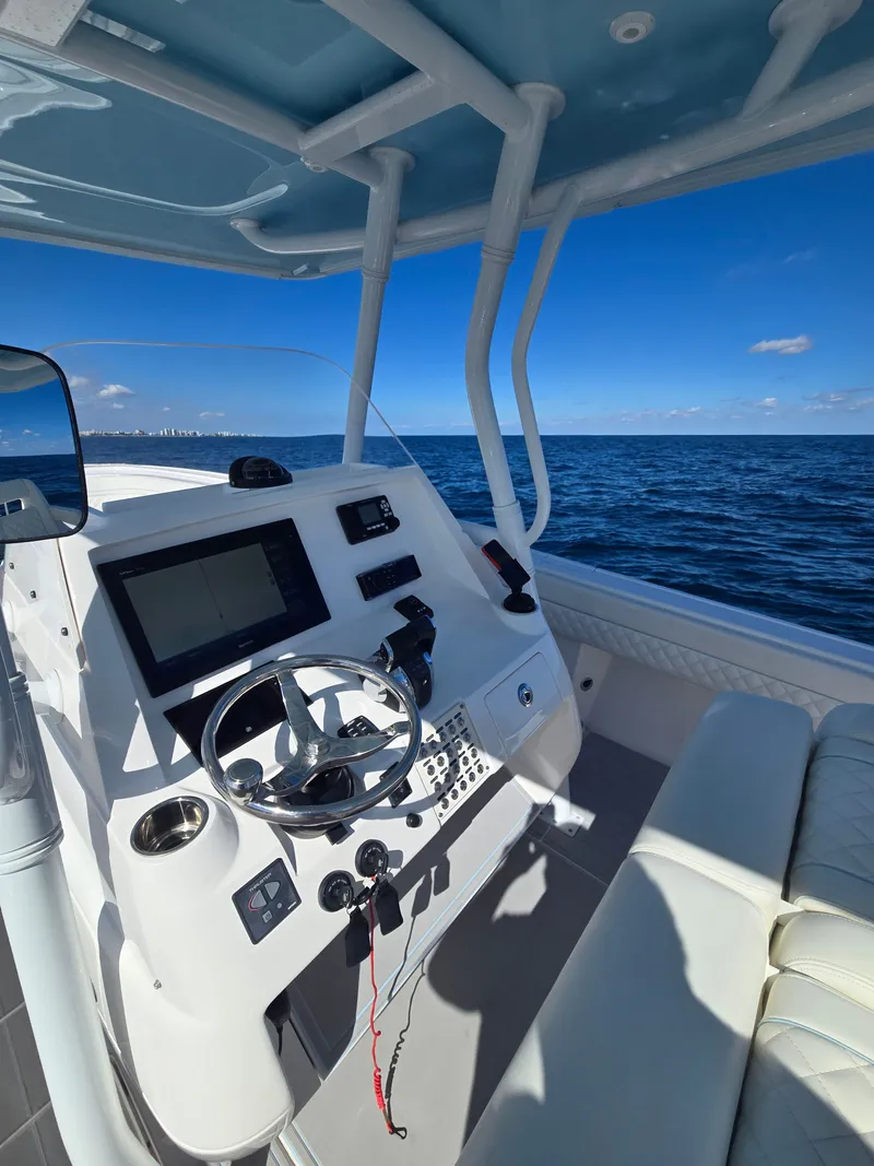 Slide: The Image of Intrepid 327 boat helm with ocean view, 2019 model. - 8