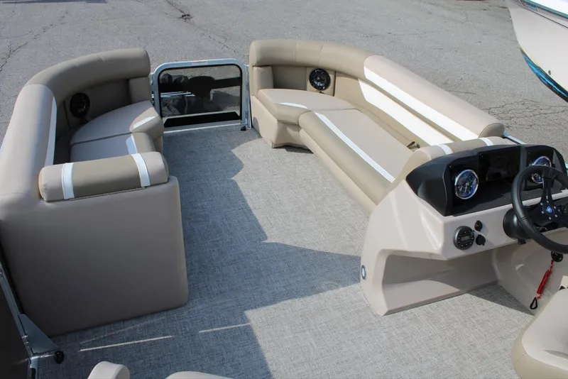 Slide: The Image of 2026 Premier 200 Sunscape RF - CL boat interior with beige seating and modern dashboard. - 6