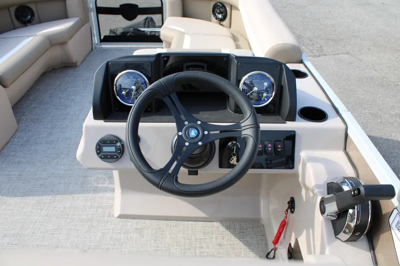 Slide: The Image of Steering console of 2026 Premier 200 Sunscape RF - CL pontoon boat, featuring modern controls. - 8