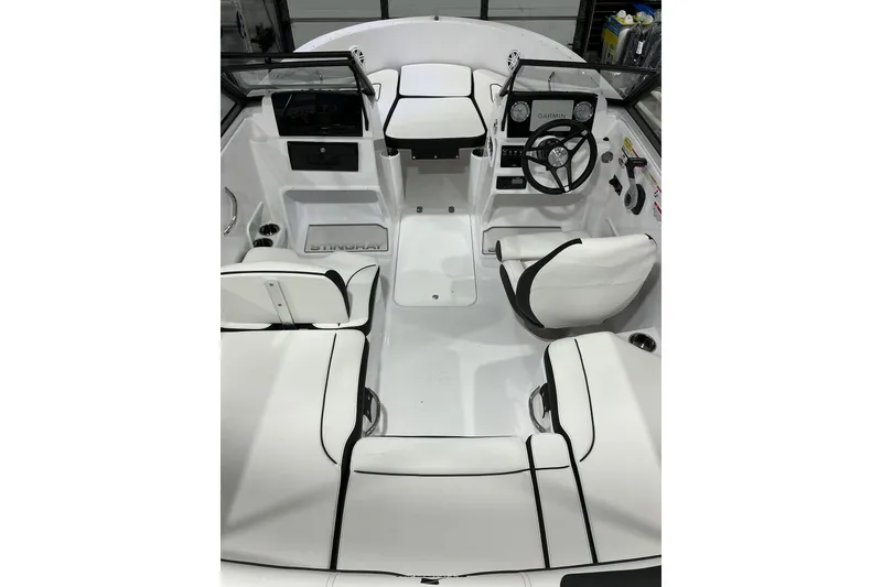 Slide: The Image of 2026 Stingray 172 DC boat interior with white seating and modern dashboard. - 6