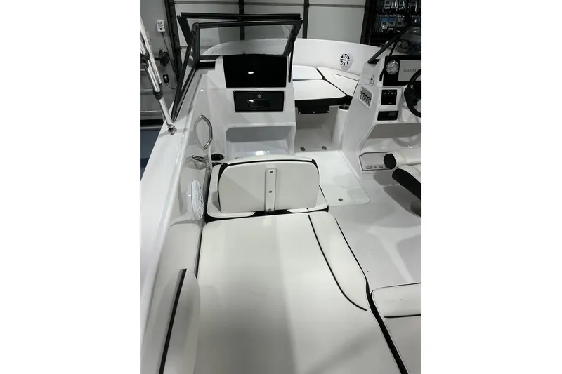 Slide: The Image of 2026 Stingray 172 DC boat interior with white seating and modern dashboard. - 8