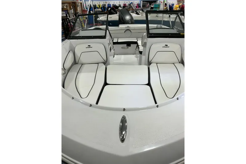 Slide: The Image of 2026 Stingray 172 DC boat interior with white seating and windshield. - 9