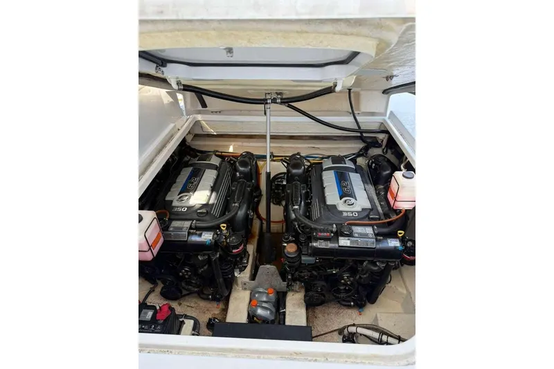 Slide: The Image of Engine compartment of 2018 Monterey 335 Sport Yacht with dual engines visible. - 12