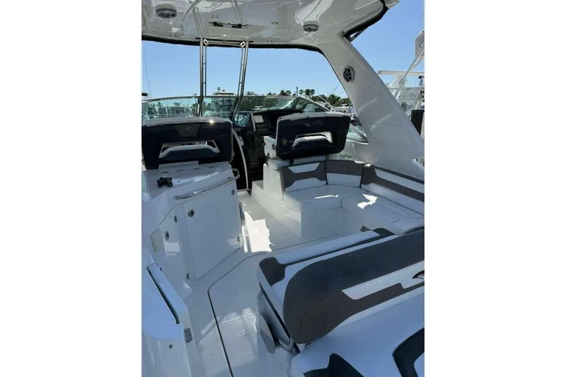Slide: The Image of 2018 Monterey 335 Sport Yacht interior with sleek seating and modern design. - 3
