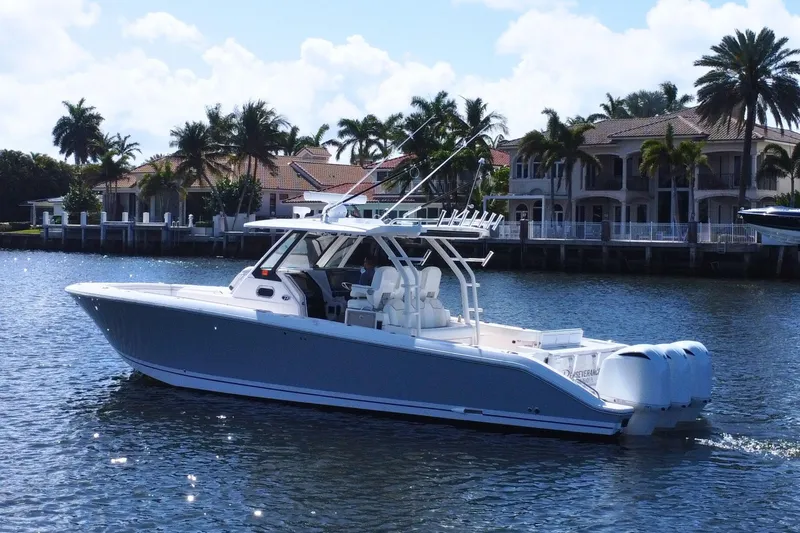 The Image of 2019 Pursuit S 368 Sport boat cruising on sparkling water. - 0