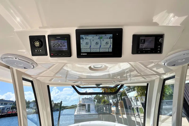 Slide: The Image of 2019 Pursuit S 368 Sport dashboard with navigation and audio controls. - 17