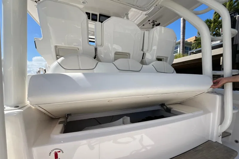 Slide: The Image of 2019 Pursuit S 368 Sport boat with open storage compartment under seats. - 22