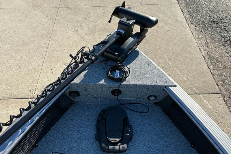 Slide: The Image of 2025 Lund 1875 Pro Guide boat with trolling motor and foot pedal on deck. - 10