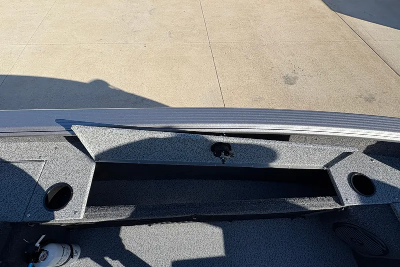 Slide: The Image of 2025 Lund 1875 Pro Guide boat interior storage compartment with open lid. - 25