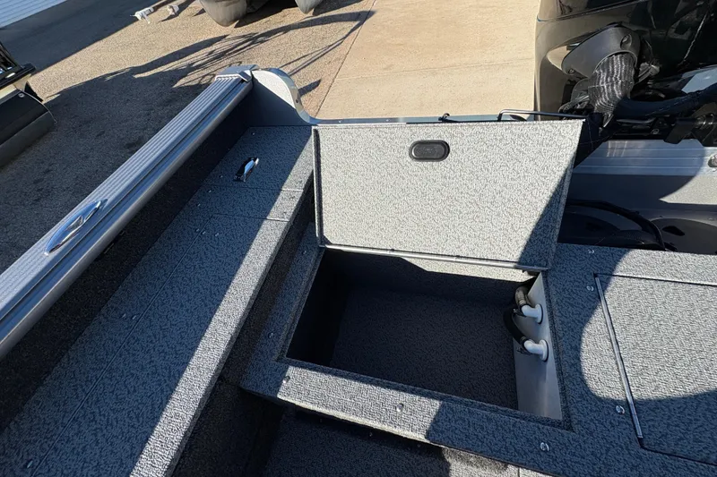 Slide: The Image of 2025 Lund 1875 Pro Guide boat interior storage compartment open. - 32