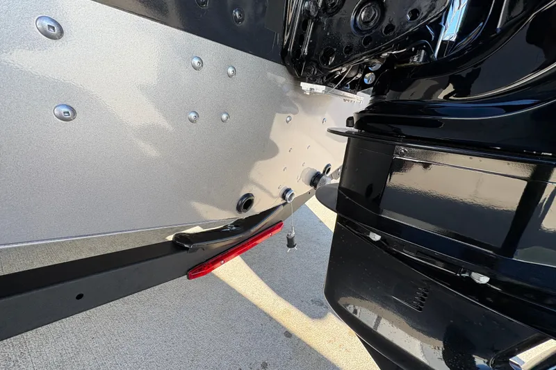 Slide: The Image of 2025 Lund 1875 Pro Guide boat detail showing sleek metallic finish and structural components. - 38