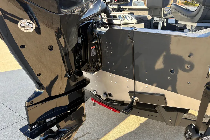 Slide: The Image of 2025 Lund 1875 Pro Guide boat with outboard motor and seating. - 8