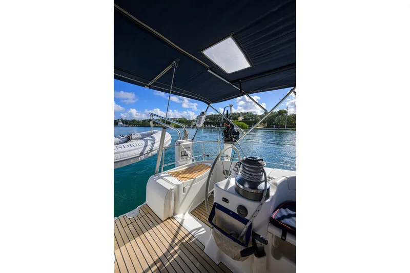 Slide: The Image of Cockpit view of 2003 Beneteau 50 sailboat with scenic waterfront backdrop. - 10