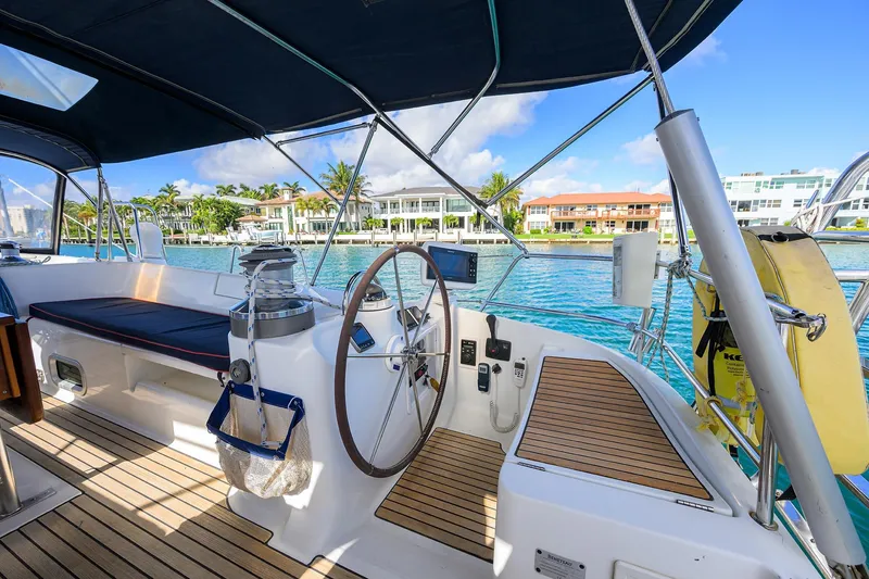 Slide: The Image of Cockpit of 2003 Beneteau 50 sailboat with waterfront view and modern amenities. - 14