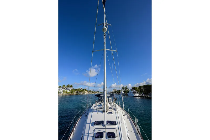 Slide: The Image of Sailing yacht Beneteau 50, 2003 model, docked in a sunny marina. - 32
